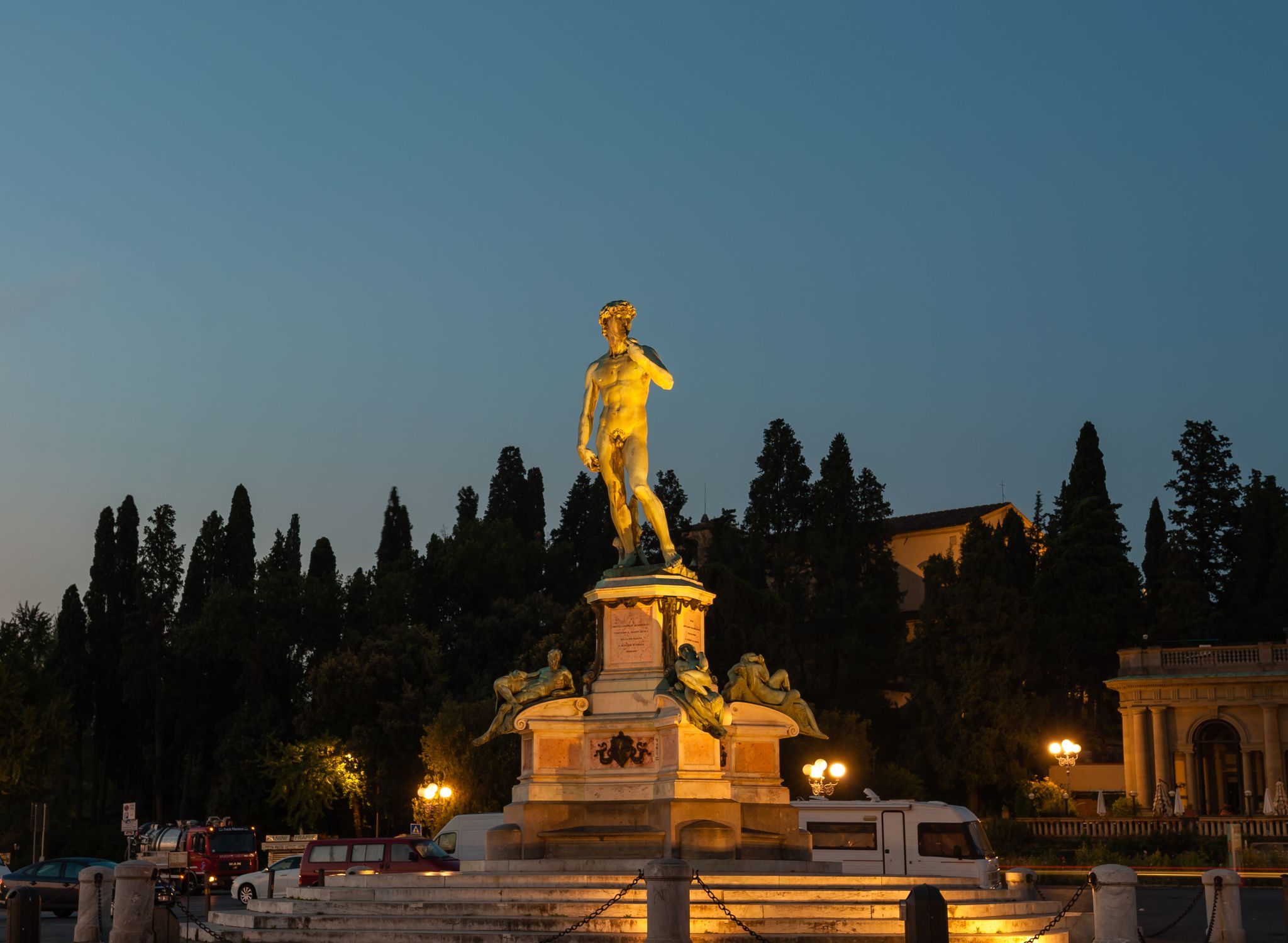 photo of Statue of david on piazzale michelangelo at night in italy.