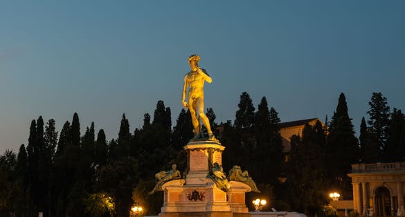 photo of Statue of david on piazzale michelangelo at night in italy.