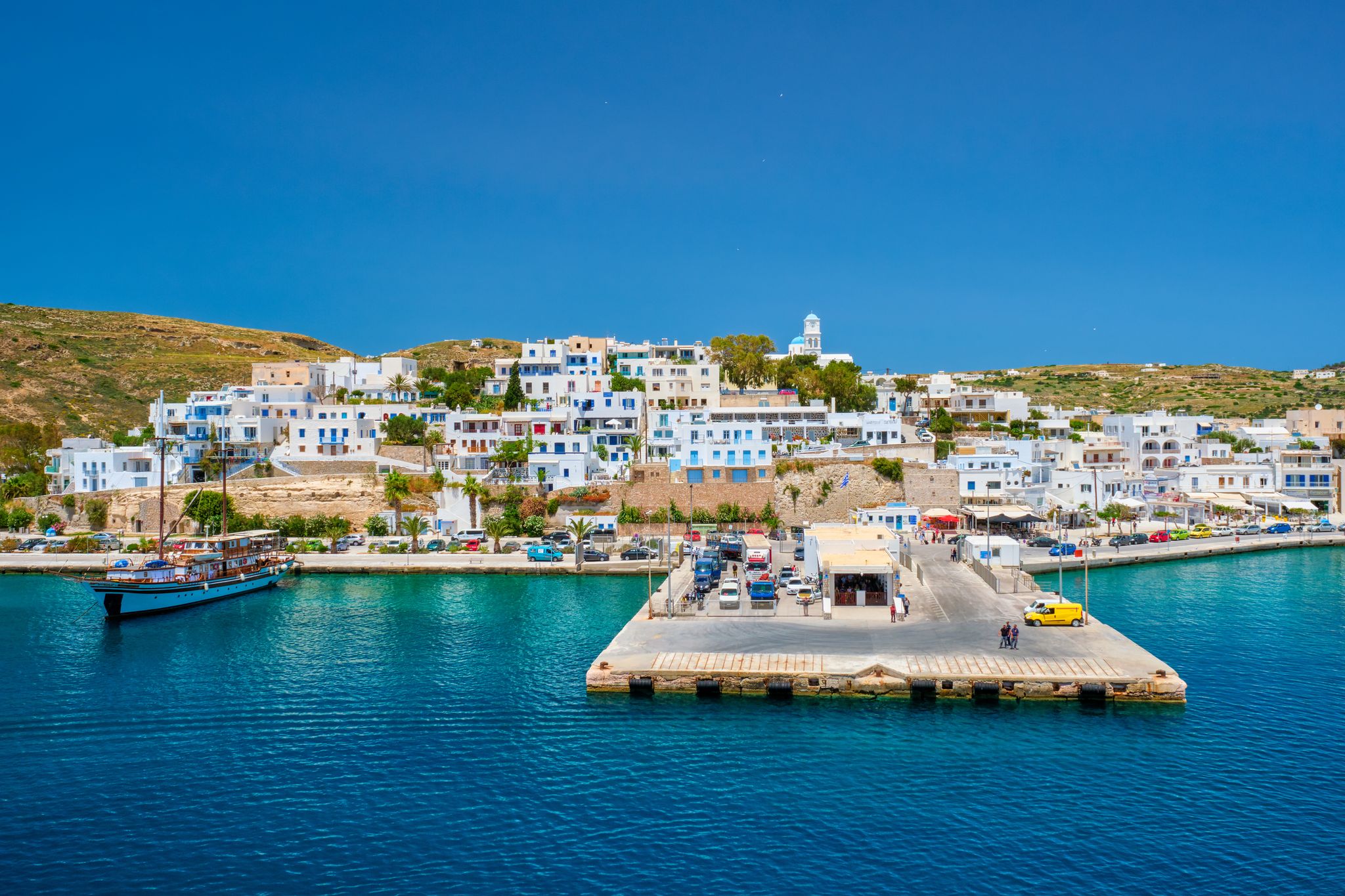 Photo of aerial view of Adamantas Adamas harbor town of Milos island. Milos, Greece.