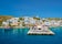 Photo of aerial view of Adamantas Adamas harbor town of Milos island. Milos, Greece.