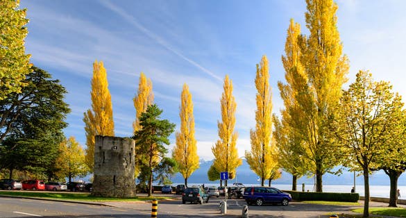 photo of beautiful view of Lake Geneva near Haldimand Tower during autumn in Lausanne, Switzerland.