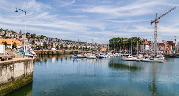 photo of view of Port of Deauville and city skyline in Normandy, France..