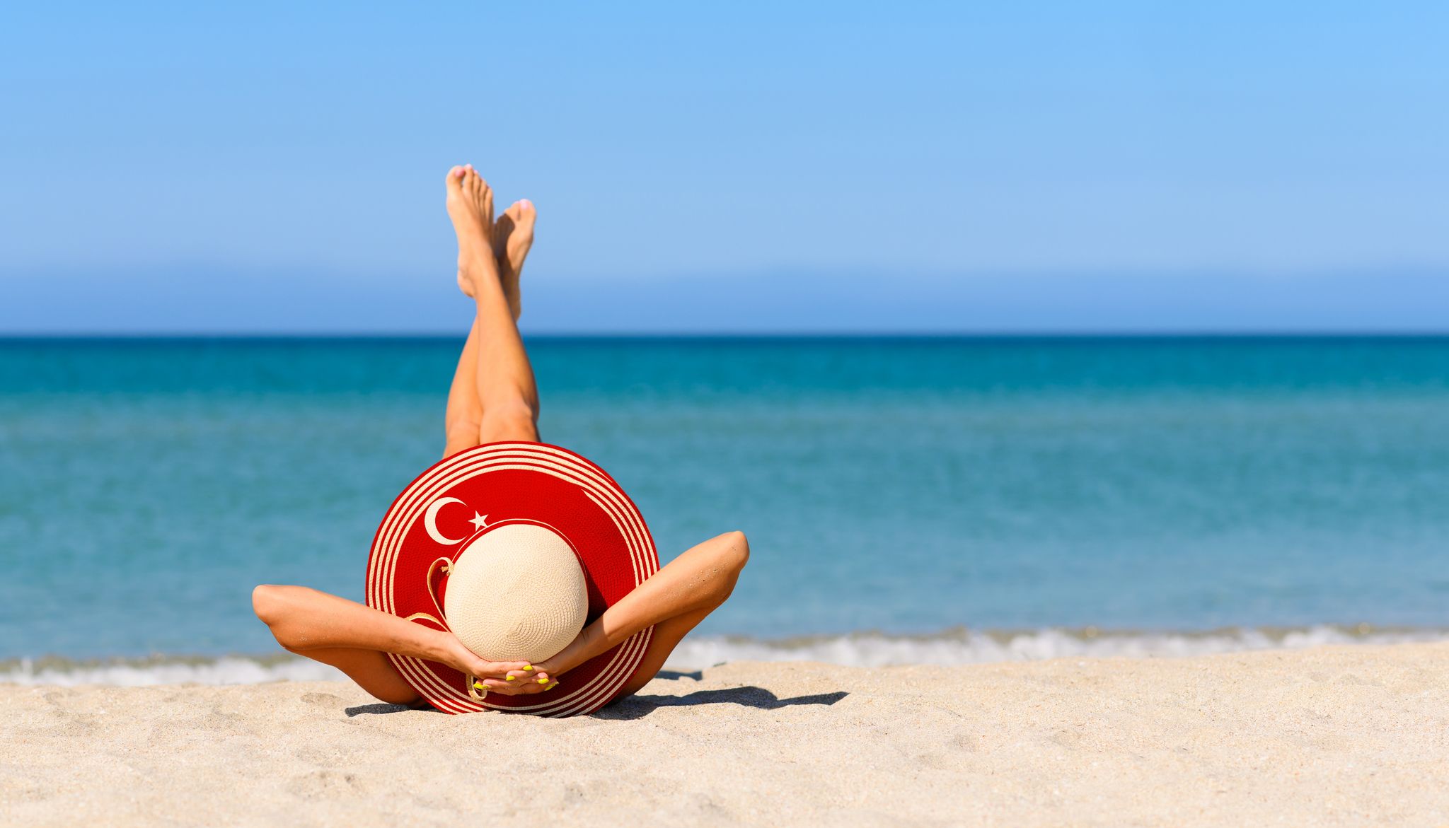 Photo of tourist girl on the beautiful beach in Kemer, Turkey. 