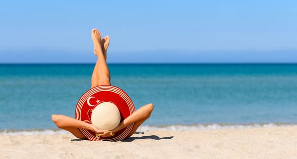 Photo of tourist girl on the beautiful beach in Kemer, Turkey. 
