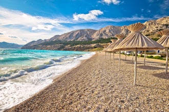 Photo of Idyllic beach in Baska view, Island of Krk, Croatia. Baska is famous tourist destination in Croatia.