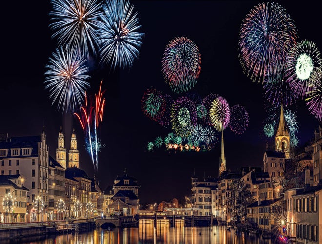 Colorful New Year’s Eve fireworks over Zurich’s Old Town and riverfront at night..jpg