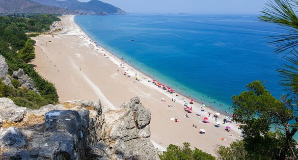 photo of landscape of Çıralı Beach from the ruins of port castle in Olympos Ancient Greek city in Antalya, Turkey.