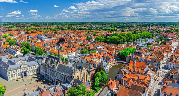 Aerial view of Bruges city centre, old buildings tiled roofs, Bruges City Hall Stadhuis, Basilica of Holy Blood, Brugse Vrije palace, Rosary Quay Rozenhoedkaai, skyline of Brugge old town, Belgium