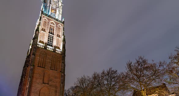 photo of night view of The Onze-Lieve-Vrouwetoren, the Tower of Our Lady in Amersfoort, The Netherlands.