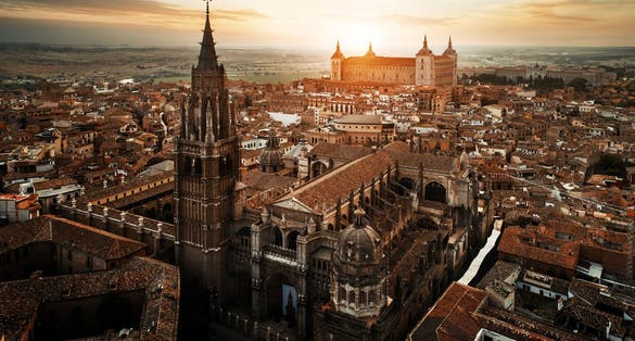 photo  of view of Primate Cathedral of Saint Mary of Toledo aerial view at sunset in Spain