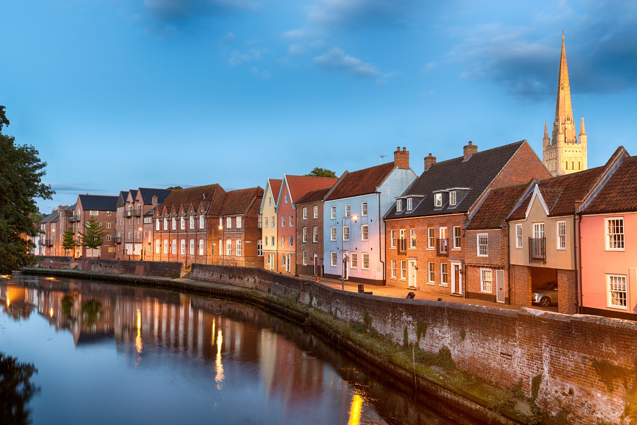 Photo of historic town houses at night on Quay Side in Norwich, Norfolk, United Kingdom.