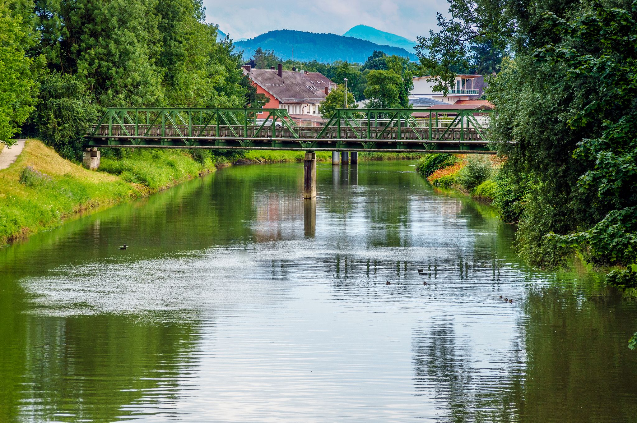 Cityscape of the city of Rosenheim in Bayern in Germany with river Mangfall and Alps mountain in background