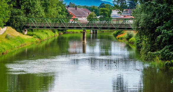 Cityscape of the city of Rosenheim in Bayern in Germany with river Mangfall and Alps mountain in background