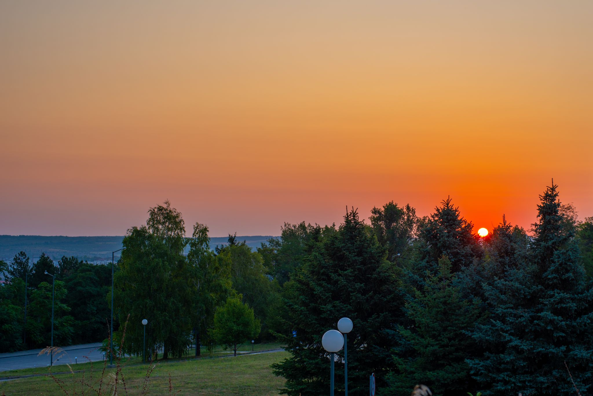 photo of view of Sunrise at Skobelev's park, near "Panorama" monument in the city of Pleven, Bulgaria,Pleven Bulgaria.