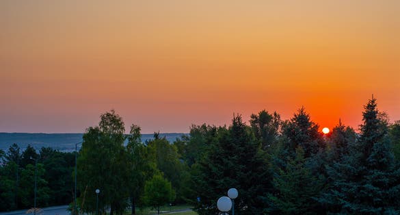 photo of view of Sunrise at Skobelev's park, near "Panorama" monument in the city of Pleven, Bulgaria,Pleven Bulgaria.