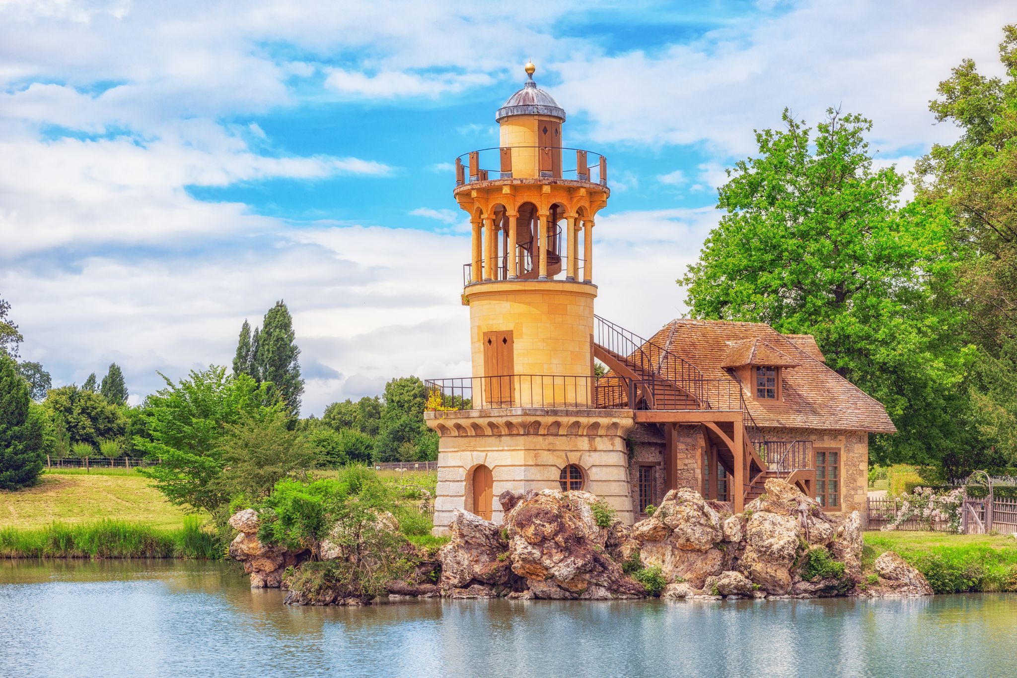 Lighthouse on the lake in hamlet Queen Marie Antoinette's estate near Versailles Palace.