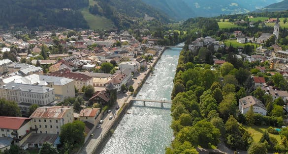 PHOTO OF VIEW OF Aerial view of Lienz cityscape and valley, Austrian alps.