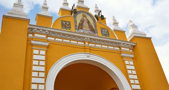 Photo of macarena door arch in seville , spain .