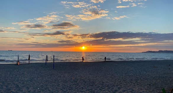 Photo of sun setting on Durrës sandy beach.