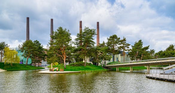 photo of view of A beautiful view of a green Autostadt park in Wolfsburg, Germany on a sunny day