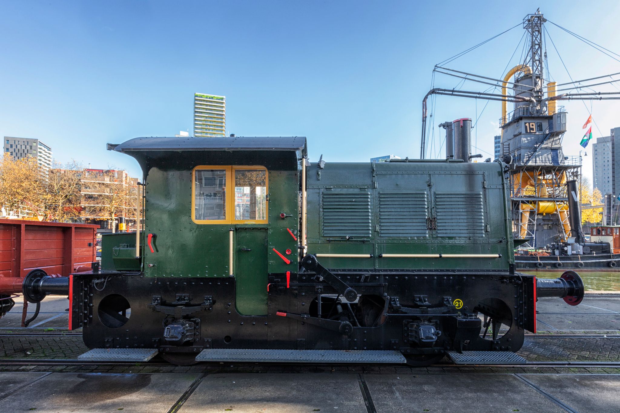 photo of Rotterdam, Netherlands. A old locomotive and old cranes that are part of the maritiem museum in Rotterdam.