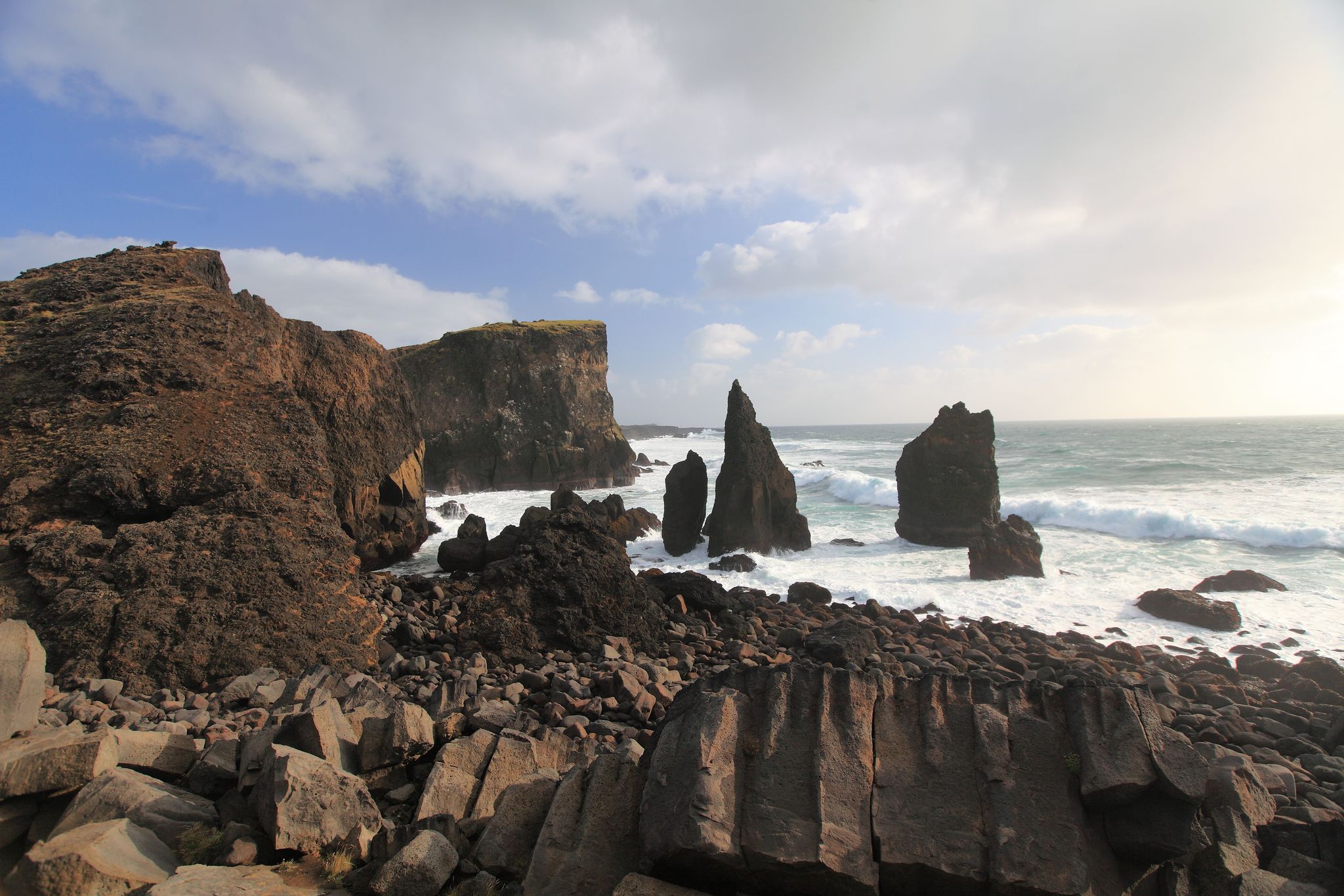 photo of view of Cliffs at the Dyrhólaey Peninsula, Iceland on the tip of Iceland's southern coast, Southern Peninsula, Iceland.