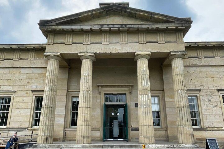 The Yorkshire Museum in York, England, with a neoclassical design, tall stone columns, and a green entrance door..jpg