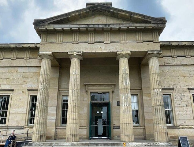 The Yorkshire Museum in York, England, with a neoclassical design, tall stone columns, and a green entrance door..jpg
