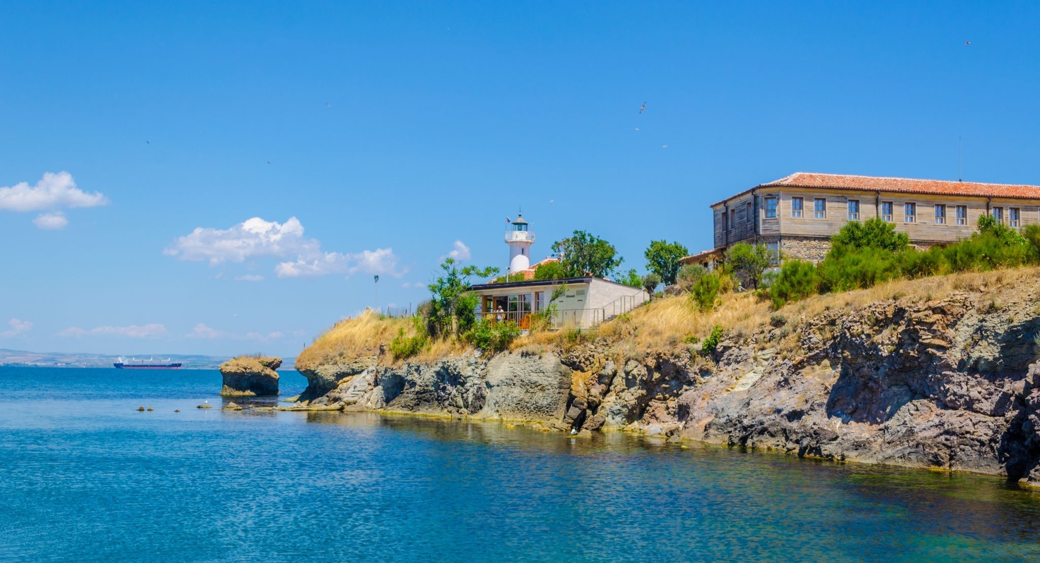 photo of view of small island of saint anastasia is a new tourist attraction in bulgaria near burgas. reconstructed museum, hotel, restaurant and lighthouse are accompanied by small cute beach.,Burgas Bulgaria.
