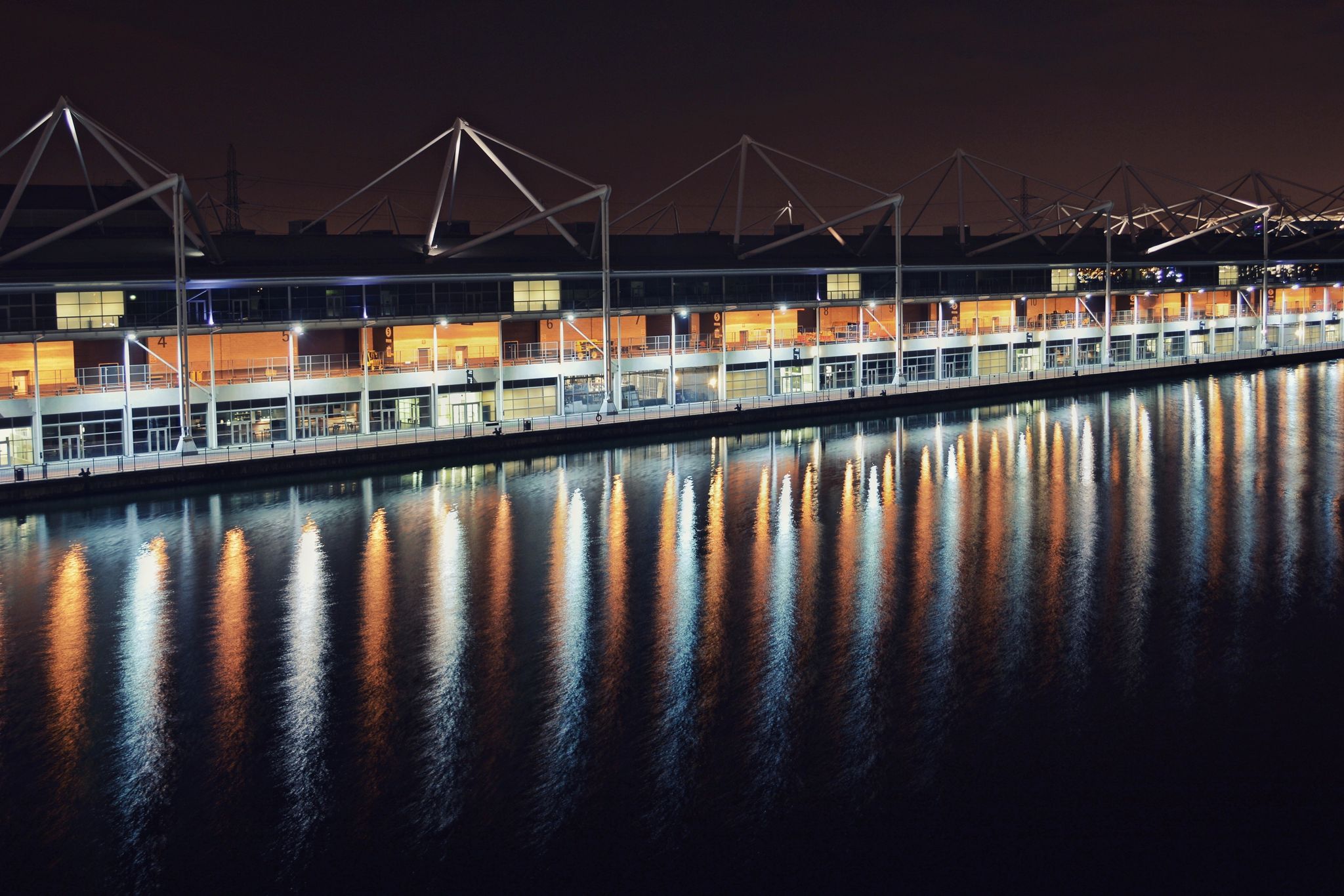 Photo of ExCeL London at night that is an exhibition and international convention centre in the Custom House area of Newham, East London, UK.