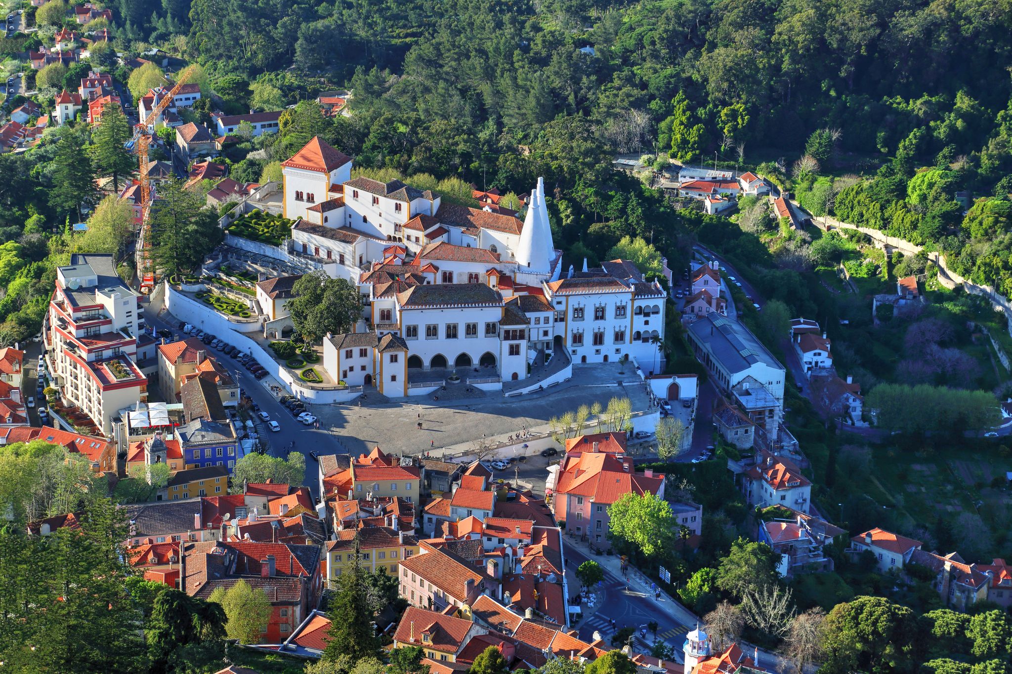Photo of aerial view of Palace of Sintra (Palacio Nacional de Sintra) in Sintra in a beautiful summer day, Portugal.