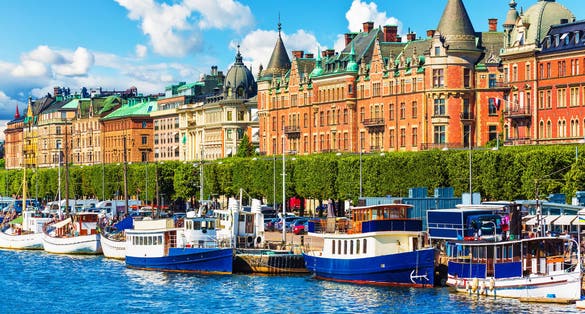 Scenic summer panorama of the Old Town (Gamla Stan) pier architecture in Stockholm, Sweden.