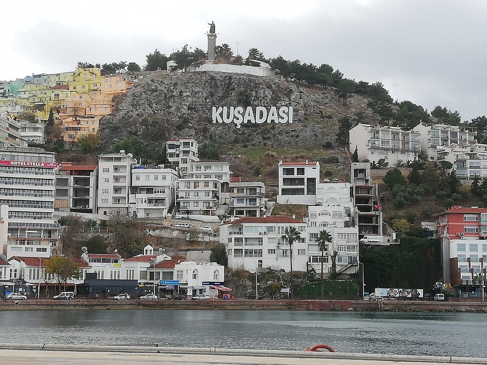 Photo of aerial view of Kuşadası beach resort town on Turkey’s western Aegean coast.