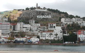 Photo of aerial view of Kuşadası beach resort town on Turkey’s western Aegean coast.