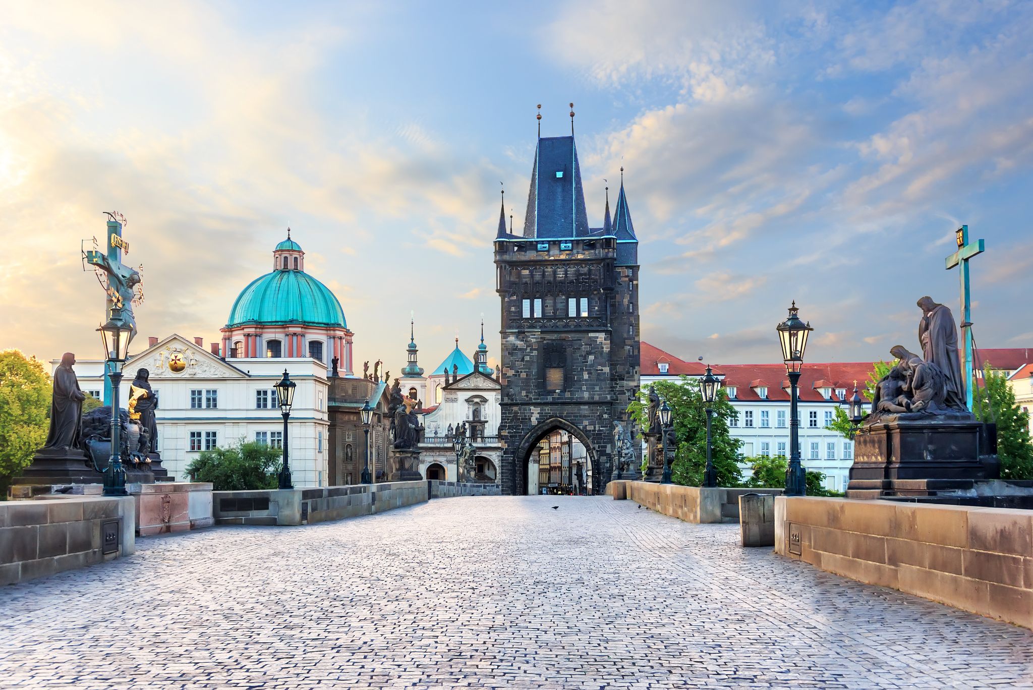 Photo of Charles Bridge leading to the Old Town Bridge Tower and St. Francis of Assisi Church, Prague.