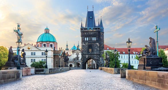 Photo of Charles Bridge leading to the Old Town Bridge Tower and St. Francis of Assisi Church, Prague.