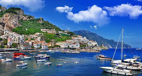 Scenic picture-postcard view of the beautiful town of Amalfi at famous Amalfi Coast with Gulf of Salerno, Campania, Italy