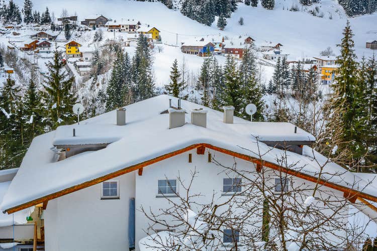 Photo of  Aerial view on snow winter village in Ischgl place, famous winter skii resort in Austra and european travel landmark. / Winter snow village Ischgl. / Selective focus.