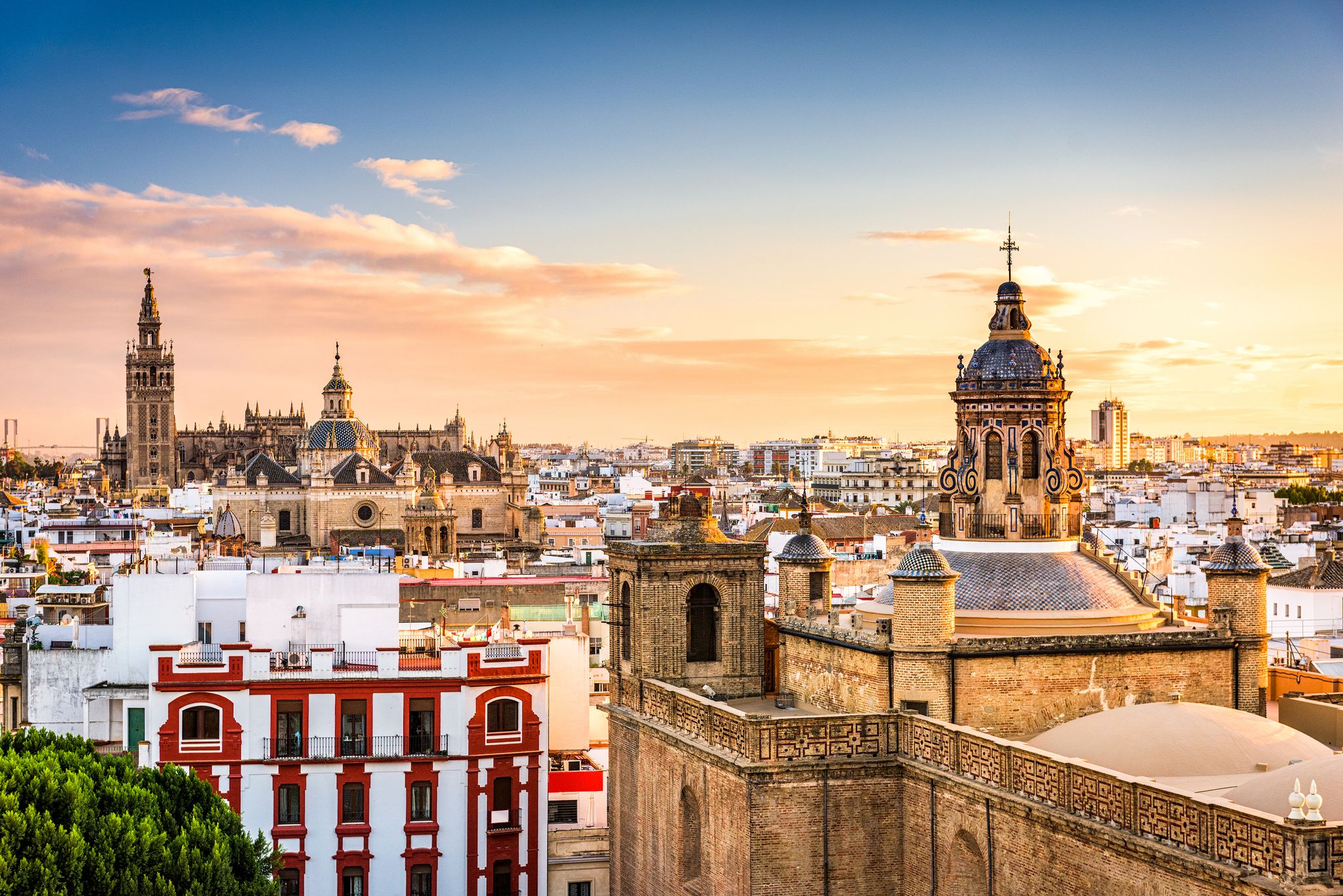 Scenic view of Seville-s skyline at sunset, featuring the Cathedral, Giralda tower, and historic architecture..jpg