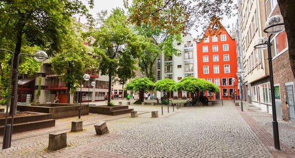 Photo of the cozy patio with green in the center of Cologne, Germany. 
