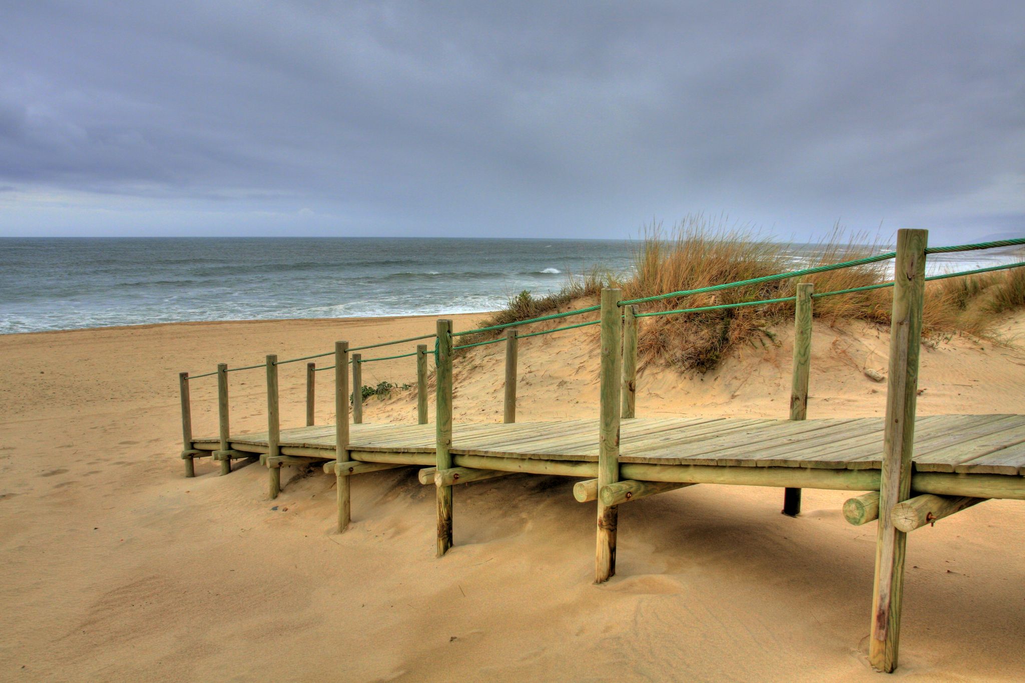 Wooden walk way over sand dune giving access to the beach, Esposende, Portugal (HDR photo).