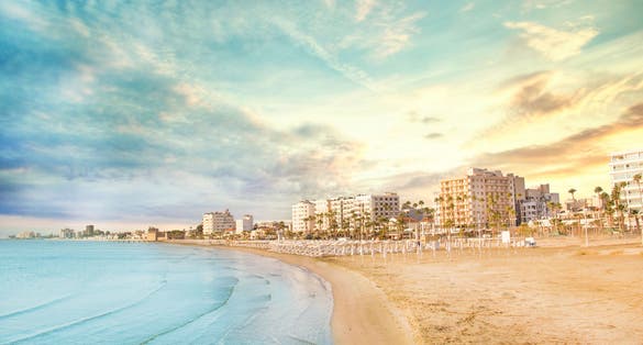 Photo of beautiful view of the main street of Larnaca and Phinikoudes beach in Cyprus on a sunny day.