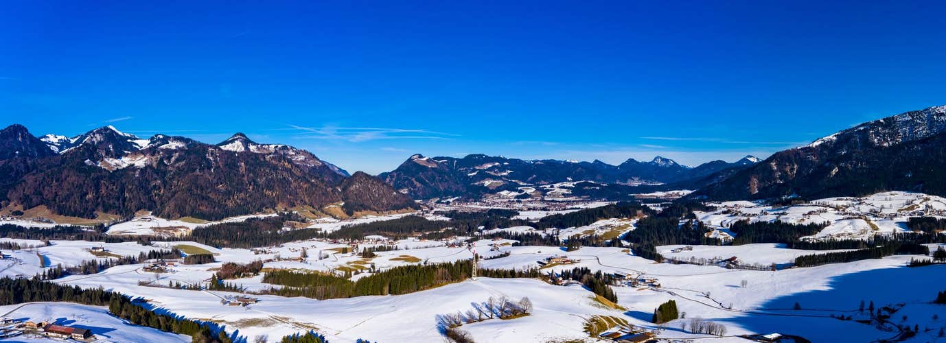 photo of view of Aerial view, view of farms in the Leukental, Kössen, Kaiserwinkl, Kitzbuehel district, Chiemgau, Tyrol, Austria.