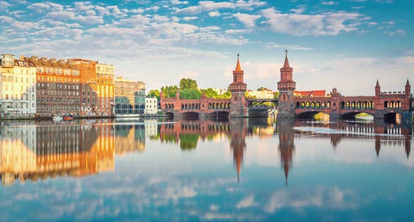 Photo of Oberbaumbruecke Berlin Summer with Reflection and Clouds.