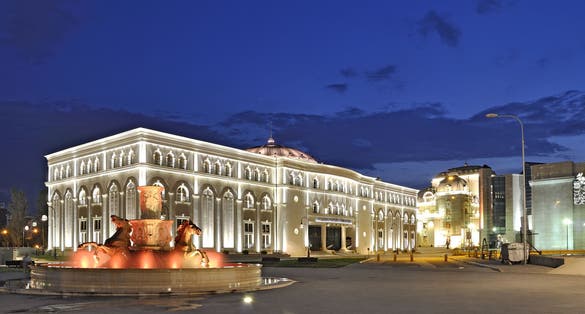 Photo of beautiful view of Museum of the Macedonian Struggle building at night in Skopje, Macedonia.