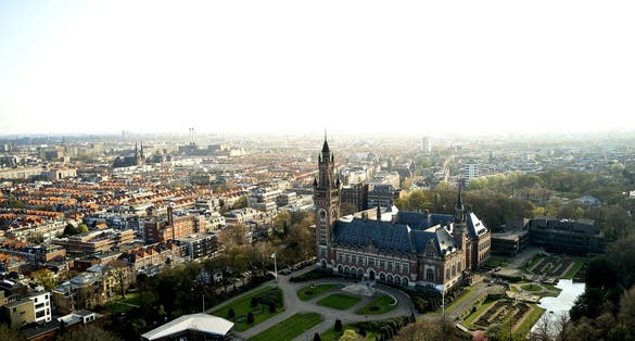 photo of The Peace Palace in The Hague in an aerial shot. The garden of the International Court of Justice can be seen around the Vredespaleis in the Netherlands.
