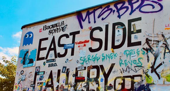 Photo of Graffiti at the East Side Gallery in Berlin, Germany., the East Side Gallery is the longest preserved stretch of the Berlin wall.