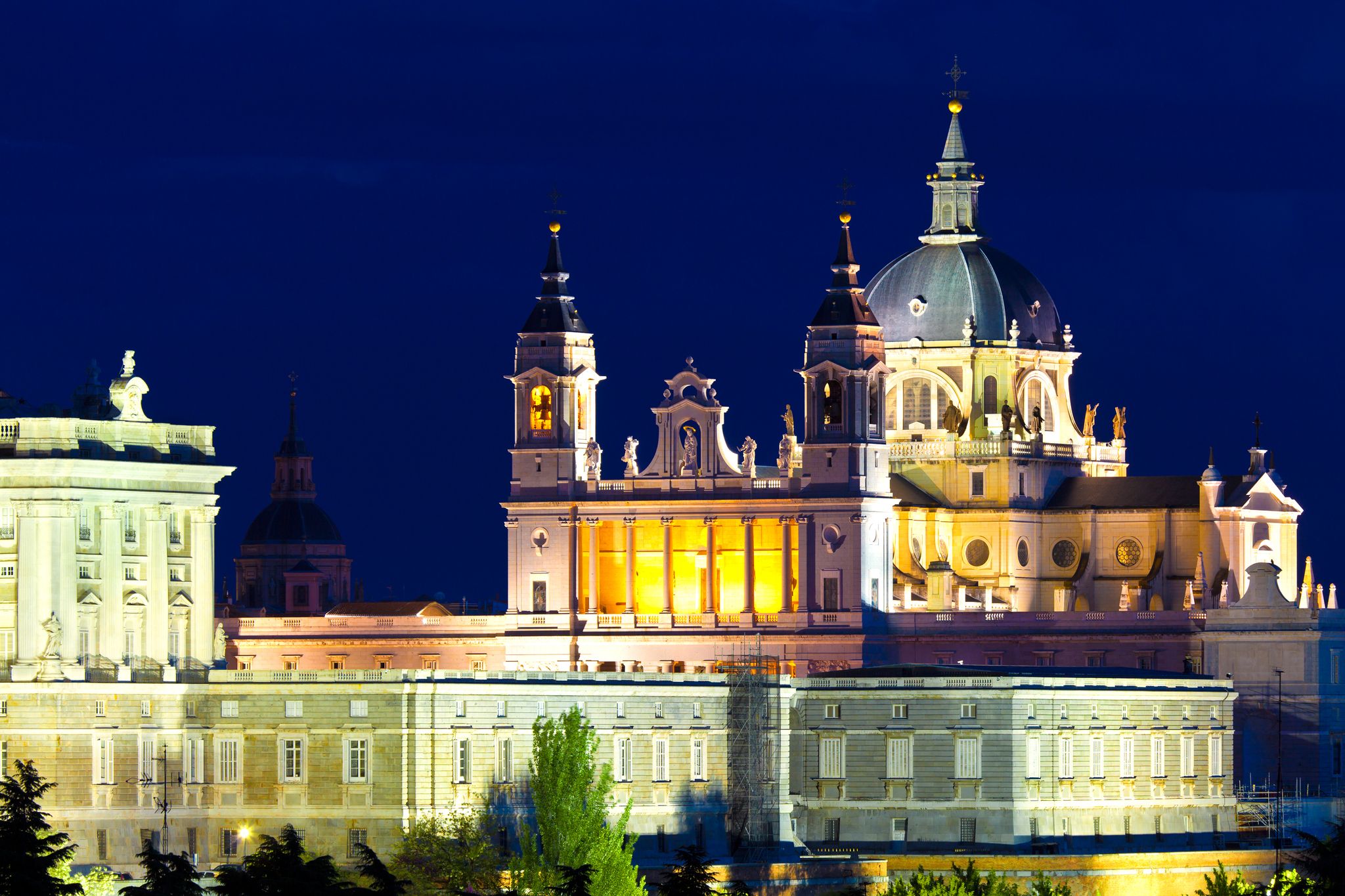 Photo of Santa Maria la Real de La Almudena - Cathedral at night in Madrid, Spain.
