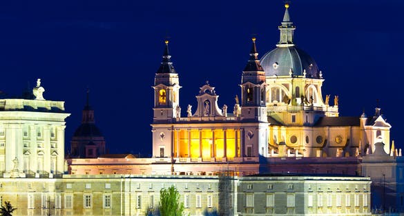 Photo of Santa Maria la Real de La Almudena - Cathedral at night in Madrid, Spain.