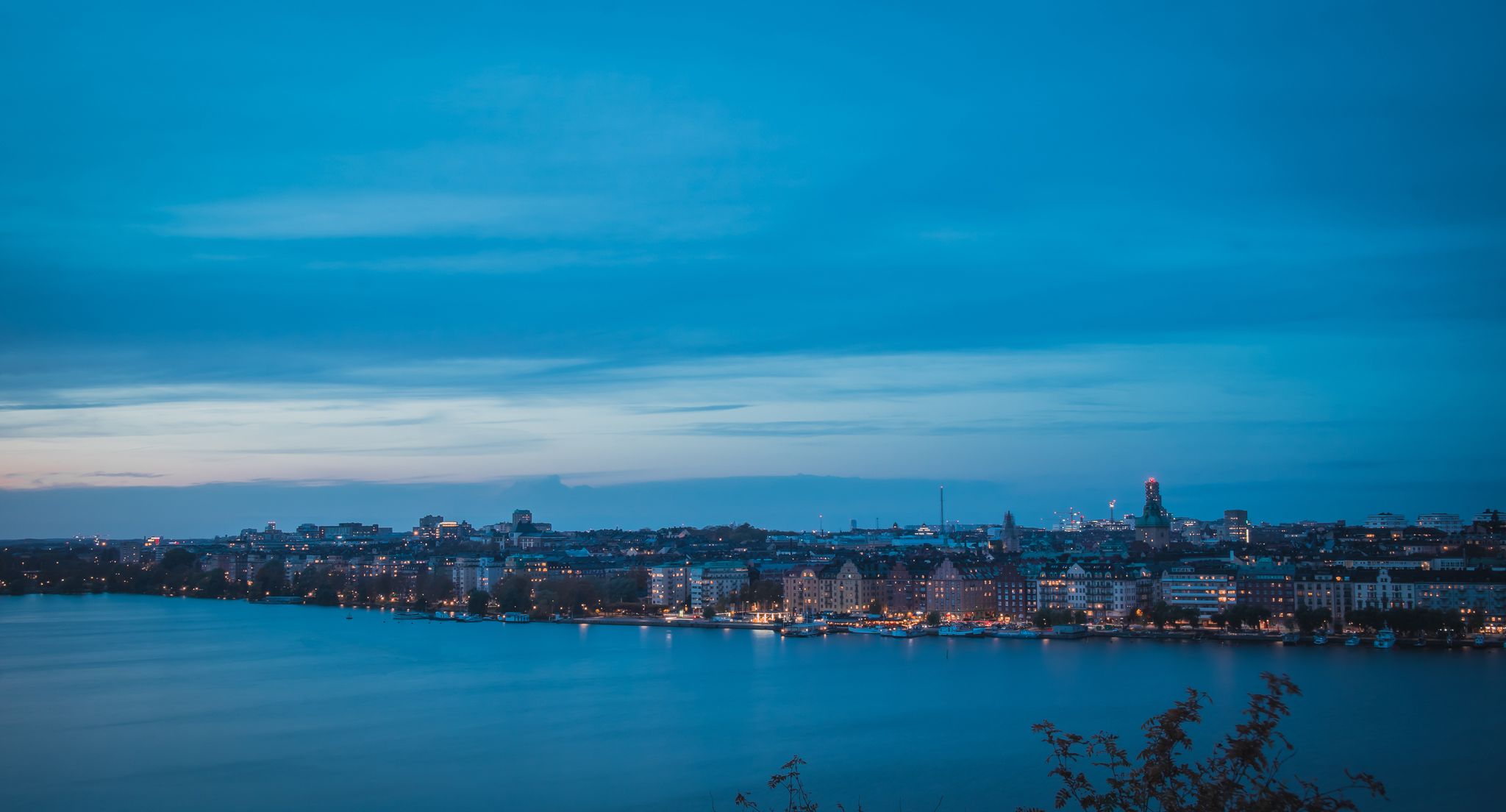 photo of beautiful landscape photo of Stockholm cityscape viewed from Skinnarviksberget on early evening in autumn in Sweden.